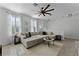 Living room with sectional sofa and large windows at 1074 Clifton Springs Ln, Winter Springs, FL 32708