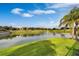 Serene pond view with lush landscaping and water fountain at 1074 Clifton Springs Ln, Winter Springs, FL 32708