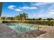 Inviting community pool surrounded by manicured landscaping and a clear blue sky at 1074 Clifton Springs Ln, Winter Springs, FL 32708