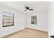 Bright bedroom with wood-look floors and ceiling fan at 1110 Oak Dr, Leesburg, FL 34748