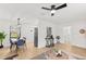 Modern dining area with a light wood table and blue chairs at 1110 Oak Dr, Leesburg, FL 34748