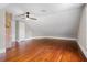 Attic bedroom with hardwood floors and ceiling fan at 119 Leon Ave, Deland, FL 32720