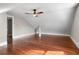 Large attic bedroom with hardwood floors and ceiling fan at 119 Leon Ave, Deland, FL 32720