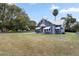 Gray house with white accents and a spacious lawn at 119 Leon Ave, Deland, FL 32720