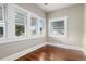 Charming living room with hardwood floors and ample window light at 119 Leon Ave, Deland, FL 32720