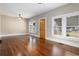 Spacious living room with hardwood floors and large windows at 119 Leon Ave, Deland, FL 32720