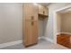 Well-designed pantry with ample storage in light wood cabinets at 119 Leon Ave, Deland, FL 32720