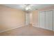 Well-lit bedroom featuring double door closet and ceiling fan at 1266 Juliana Pl, Orlando, FL 32807