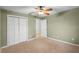 Bright bedroom with double door closet and ceiling fan at 1266 Juliana Pl, Orlando, FL 32807