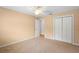 Well-lit bedroom featuring double door closet and ceiling fan at 1266 Juliana Pl, Orlando, FL 32807