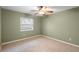 Simple bedroom with neutral walls and carpet flooring at 1266 Juliana Pl, Orlando, FL 32807