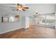 Dining area with tile floors, kitchen passthrough, and pool view at 1266 Juliana Pl, Orlando, FL 32807