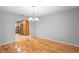 View of kitchen from dining room with hardwood floors at 1266 Juliana Pl, Orlando, FL 32807