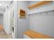 Hallway with built-in bench, hooks, and barn door at 1266 Juliana Pl, Orlando, FL 32807