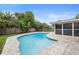 Inviting kidney-shaped pool with ample patio space at 1266 Juliana Pl, Orlando, FL 32807