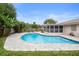 Inviting kidney-shaped pool with ample patio space at 1266 Juliana Pl, Orlando, FL 32807