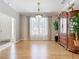 Formal dining room with hardwood floors and large window at 1318 Lucky Pennie Way, Apopka, FL 32712