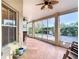 Spacious screened porch with tiled floor and access to backyard at 1318 Lucky Pennie Way, Apopka, FL 32712