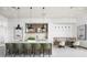 Stylish kitchen featuring a long island with seating, modern lighting and art work at 1443 Ridgeback Ln, Apopka, FL 32703