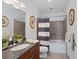 Clean bathroom with granite vanity and tiled shower/tub at 150 E Robinson St # 14A, Orlando, FL 32801