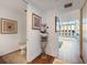 Bright hallway with hardwood floors and access to powder room at 150 E Robinson St # 14A, Orlando, FL 32801