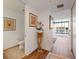 Bright hallway with hardwood floors and access to powder room at 150 E Robinson St # 14A, Orlando, FL 32801