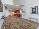 Open living area with spiral staircase, loft, and large rug at 150 E Robinson St # 14A, Orlando, FL 32801