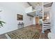 Living room featuring a spiral staircase and loft area at 150 E Robinson St # 14A, Orlando, FL 32801