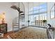 Bright living room with spiral staircase and city views at 150 E Robinson St # 14A, Orlando, FL 32801