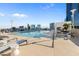 Resort-style pool with lounge chairs and a pergola at 150 E Robinson St # 14A, Orlando, FL 32801