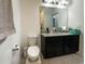 Bathroom includes a toilet, vanity with granite top at 15343 Willow Arbor Cir, Orlando, FL 32824