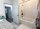 Bathroom with a bathtub, shower, and granite countertop at 15343 Willow Arbor Cir, Orlando, FL 32824