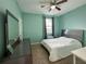 Bright bedroom with a queen bed and window coverings at 15343 Willow Arbor Cir, Orlando, FL 32824