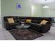 Living room featuring a large sectional sofa and a coffee table at 15343 Willow Arbor Cir, Orlando, FL 32824