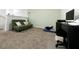 Small home office with a sofa, desk, and carpeted floor at 15343 Willow Arbor Cir, Orlando, FL 32824