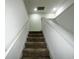 Carpeted staircase leading to the upper level at 15343 Willow Arbor Cir, Orlando, FL 32824