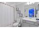 Bathroom with shower/tub combo and gray vanity at 16205 Saint Kitts Cir, Clermont, FL 34714