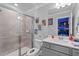 Bathroom with shower, toilet, vanity, and comic book decor at 16205 Saint Kitts Cir, Clermont, FL 34714