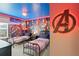 bedroom with twin beds and Avengers mural at 16205 Saint Kitts Cir, Clermont, FL 34714