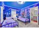 bedroom with twin beds and a Disney themed mural at 16205 Saint Kitts Cir, Clermont, FL 34714