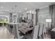 Elegant dining room with gray chairs and a modern dining table at 16205 Saint Kitts Cir, Clermont, FL 34714