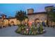 Stunning stone exterior featuring a circular driveway with lush landscaping and fountain, exuding elegance and curb appeal at 16800 Bolsena Dr, Montverde, FL 34756