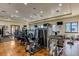 Well-equipped gym with modern exercise machines and ample lighting, perfect for maintaining an active lifestyle at 16800 Bolsena Dr, Montverde, FL 34756