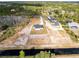 Aerial view of two homes on a large lot near water at 20316 Sheldon St, Orlando, FL 32833