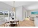 Bright dining area with round table and white chairs near kitchen at 20316 Sheldon St, Orlando, FL 32833