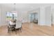 Light and airy dining room with hardwood floors and a view into another living space at 20316 Sheldon St, Orlando, FL 32833