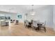 Bright dining area with hardwood floors and a large table, offering ample space for gatherings at 20316 Sheldon St, Orlando, FL 32833