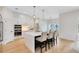 Contemporary kitchen featuring white cabinets, a sizable island, and top-of-the-line appliances at 20316 Sheldon St, Orlando, FL 32833