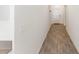 Bright hallway with wood-look tile floors and access to other rooms at 2037 Freemark St, Osteen, FL 32764