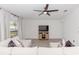 Bright living room featuring a sectional sofa and built-in shelving at 2037 Freemark St, Osteen, FL 32764